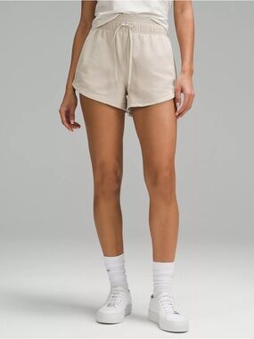 The lululemon Inner Glow High-Rise Short 3" Size: 8
Colour: Mojave Tan